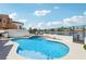 Stunning pool area features a waterfall, tanning deck, and privacy fence, perfect for relaxation and entertainment at 2469 Sun Reef Rd, Las Vegas, NV 89128