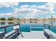 Picturesque waterfront view, showcasing the community's serene lakeside living with houses and lush landscaping at 2469 Sun Reef Rd, Las Vegas, NV 89128