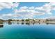 Expansive waterfront view showcasing tranquil waters, serene reflections, and beautiful homes along the shore at 2469 Sun Reef Rd, Las Vegas, NV 89128