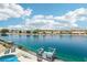 Beautiful waterfront view from this home with a dock, pool, and lush landscaping at 2469 Sun Reef Rd, Las Vegas, NV 89128