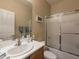 Bright bathroom featuring single sink vanity, updated fixtures, and shower-tub combination at 2473 Luminous Stars St, Henderson, NV 89044