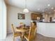 Cozy dining area adjacent to the kitchen with natural lighting and neutral color palette at 2473 Luminous Stars St, Henderson, NV 89044