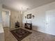 Elegant entrance with tile floors, chandelier, and stylish decor at 2473 Luminous Stars St, Henderson, NV 89044