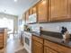 Functional kitchen featuring modern appliances, ample counter space, and rich wood cabinetry at 2473 Luminous Stars St, Henderson, NV 89044