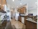 Functional kitchen with stainless steel appliances, granite countertops, and wood cabinetry at 2473 Luminous Stars St, Henderson, NV 89044