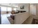 Open living room with tile floors, ample windows, and neutral color palette at 2473 Luminous Stars St, Henderson, NV 89044