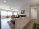 Comfortable living room with tile flooring and great natural light throughout the open concept space at 2473 Luminous Stars St, Henderson, NV 89044