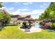 Large backyard with mature trees, pool, and outdoor entertaining area at 259 Rockwell Springs Ct, Henderson, NV 89012