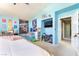 Bright bedroom with colorful walls and decor, a TV, and light carpet at 259 Rockwell Springs Ct, Henderson, NV 89012