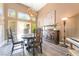 Elegant dining room with a round table, statement lighting, and large windows at 259 Rockwell Springs Ct, Henderson, NV 89012