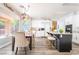 Eat-in kitchen features a dining table, an island with bar seating, white cabinets and stainless appliances at 259 Rockwell Springs Ct, Henderson, NV 89012