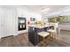 Eat-in kitchen showcasing a dark island with granite countertop and counter seating at 259 Rockwell Springs Ct, Henderson, NV 89012