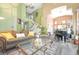 Spacious living room featuring a spiral staircase, high ceilings, and an open floor plan at 259 Rockwell Springs Ct, Henderson, NV 89012