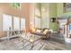 Bright and airy living room with high ceilings, large windows, and modern decor at 259 Rockwell Springs Ct, Henderson, NV 89012