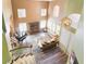 Grand living room featuring high ceilings, a piano, and a second-floor view at 259 Rockwell Springs Ct, Henderson, NV 89012