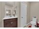 Modern half-bath featuring a toilet, vanity with a white countertop, and neutral-toned walls at 2714 Frabiele St, Henderson, NV 89044