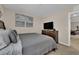 Comfortable bedroom with natural light, a queen bed, and decor at 2714 Frabiele St, Henderson, NV 89044