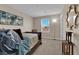 Neutral bedroom featuring a queen bed, ample natural light, and decor at 2714 Frabiele St, Henderson, NV 89044