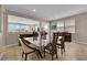 Bright dining room featuring modern furnishings, ample natural light, and seamless flow to adjacent spaces at 2714 Frabiele St, Henderson, NV 89044