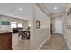 View of dining room and living room separated by an open partition, with neutral paint and tile floors at 2714 Frabiele St, Henderson, NV 89044