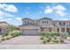 Charming two-story home with a two-car garage and beautifully landscaped front yard in a residential neighborhood at 2714 Frabiele St, Henderson, NV 89044