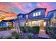 Attractive two-story home with brick-paved walkway and driveway with lush, green landscaping at 2714 Frabiele St, Henderson, NV 89044