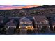 Aerial view of homes with brick driveways, solar panels, and landscaped yards at 2714 Frabiele St, Henderson, NV 89044