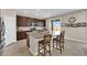 Modern kitchen with large granite island, stainless steel appliances, and barstool seating at 2714 Frabiele St, Henderson, NV 89044