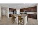 Kitchen with tile flooring, stainless steel appliances, granite counters, and large island with seating at 2714 Frabiele St, Henderson, NV 89044