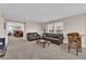 Comfortable living room with a pair of leather couches, and large windows letting in plenty of light at 2714 Frabiele St, Henderson, NV 89044