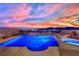 Backyard pool and spa illuminated, offering stunning city views in the background at 2714 Frabiele St, Henderson, NV 89044