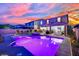Backyard oasis with pool, spa, covered patio, and lush landscaping at 2714 Frabiele St, Henderson, NV 89044