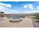 Resort-style pool and spa area with a spacious patio and a view of the surrounding landscape at 2714 Frabiele St, Henderson, NV 89044