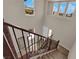 A well-lit staircase with modern railings and a view of the neighborhood at 2714 Frabiele St, Henderson, NV 89044