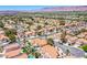 Scenic aerial view of a vibrant residential community featuring terracotta-roofed homes and mountain views at 2752 Devita Cir, Las Vegas, NV 89117