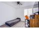 Bedroom with wood-look floors, ceiling fan, and desk at 2752 Devita Cir, Las Vegas, NV 89117
