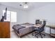 Bedroom with wood-look floors, ceiling fan and desk at 2752 Devita Cir, Las Vegas, NV 89117