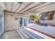 View of the covered patio, with access to the backyard, featuring gravel landscaping and a storage shed at 2752 Devita Cir, Las Vegas, NV 89117
