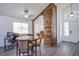 Open-concept living space featuring a rustic divider, dining table, and office workstation at 2752 Devita Cir, Las Vegas, NV 89117