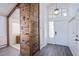 The open-concept living space features a rustic divider and view of the home's front door at 2752 Devita Cir, Las Vegas, NV 89117