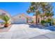 Inviting single-story home with neat landscaping, a two-car garage, and a cozy entrance at 2752 Devita Cir, Las Vegas, NV 89117