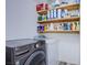 Clean laundry room with LG washer and dryer and wood shelving at 2752 Devita Cir, Las Vegas, NV 89117