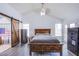 Bedroom with wood-look floors, barn door and bed at 2752 Devita Cir, Las Vegas, NV 89117