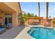 Backyard with a pool, patio, and pergola with a grill, perfect for outdoor entertaining at 286 Bowsprit Ct, Las Vegas, NV 89183