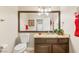 Powder room featuring granite counters, a large mirror, and tiled floors at 286 Bowsprit Ct, Las Vegas, NV 89183