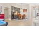Cozy dining area with wine fridge, wood table set, chandelier, and views of the front yard at 286 Bowsprit Ct, Las Vegas, NV 89183