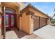 Close-up view of the home's front entrance, highlighting the red double doors and three-car garage at 286 Bowsprit Ct, Las Vegas, NV 89183