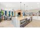 Open-concept living room with access to the kitchen, dining area, and outdoor patio, perfect for entertaining at 286 Bowsprit Ct, Las Vegas, NV 89183