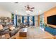 Bright living room with stylish furniture, a large rug, and a view of the backyard pool area at 286 Bowsprit Ct, Las Vegas, NV 89183