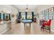 Bright and open living area featuring a pool table, arcade game, and comfortable seating arrangements at 286 Bowsprit Ct, Las Vegas, NV 89183